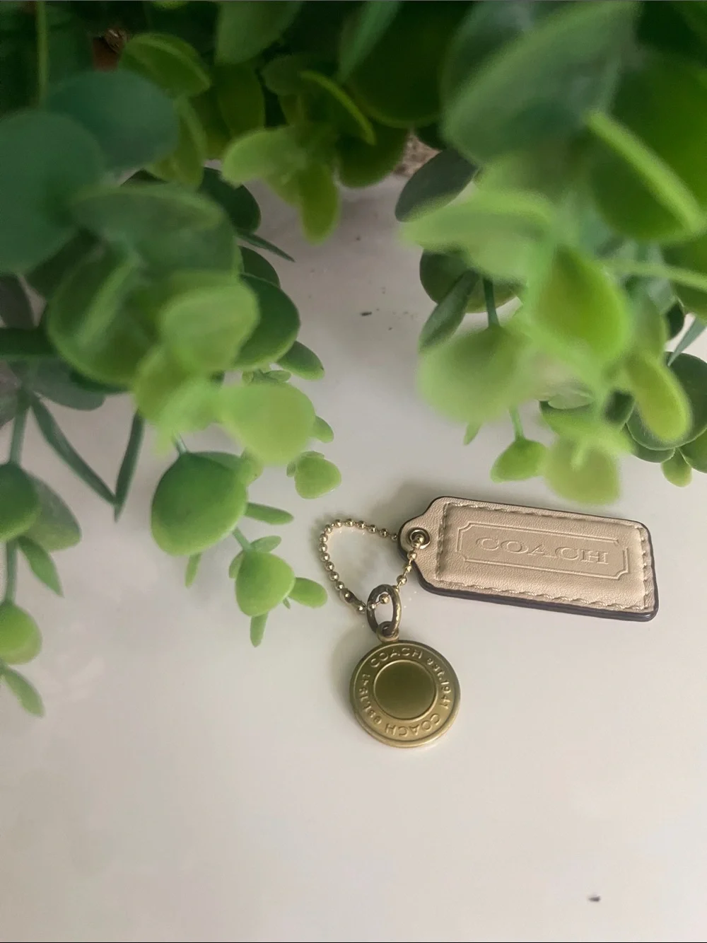 Coach Beige Leather Tag with Gold Medallion Charm  Some discoloration